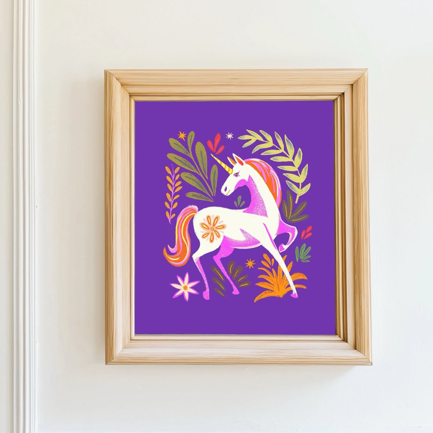 Framed artwork of a unicorn on a purple background