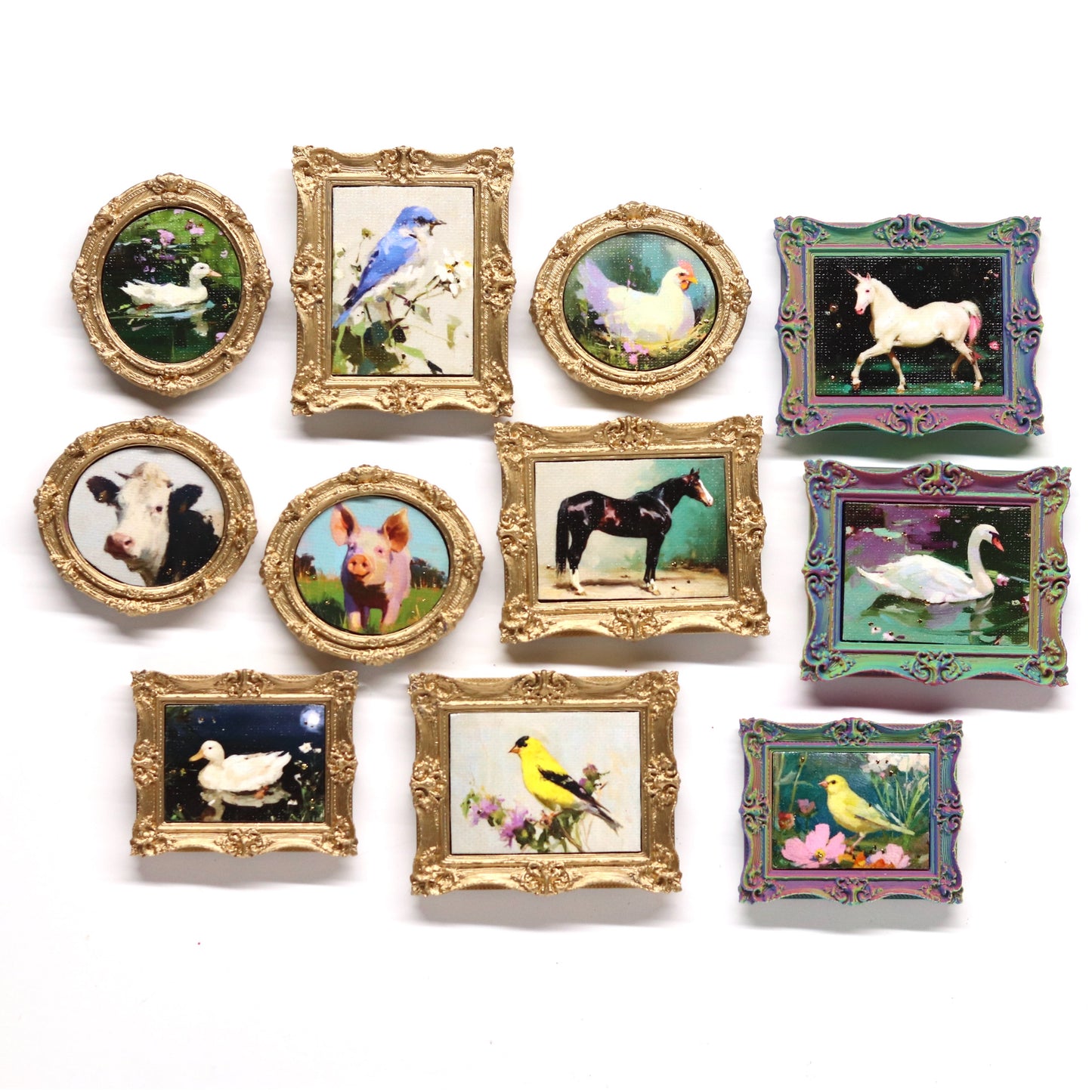Collection of small framed pictures with animal illustrations on a white background