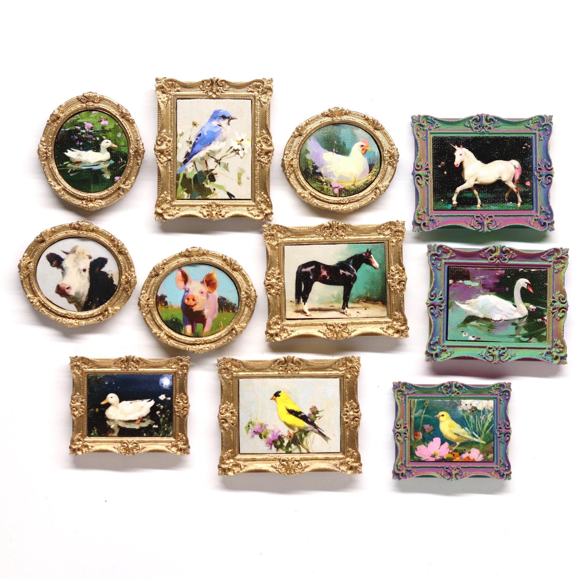Collection of small framed pictures with animal illustrations on a white background
