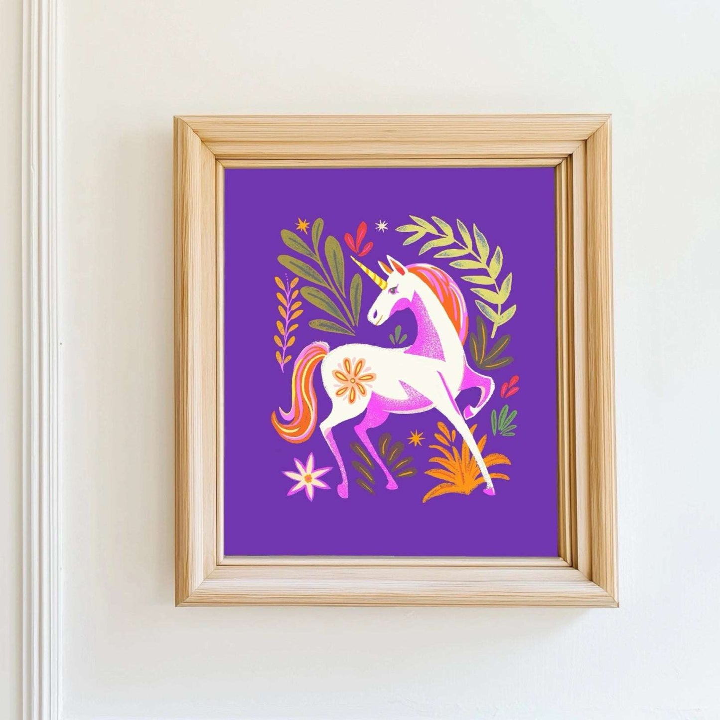Framed artwork of a unicorn on a purple background