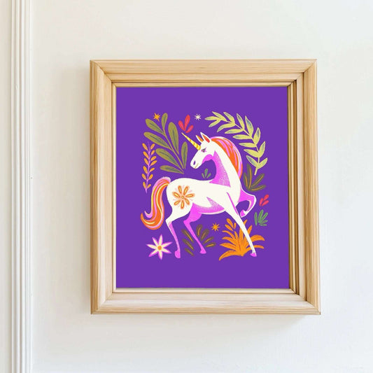 Framed artwork of a unicorn on a purple background